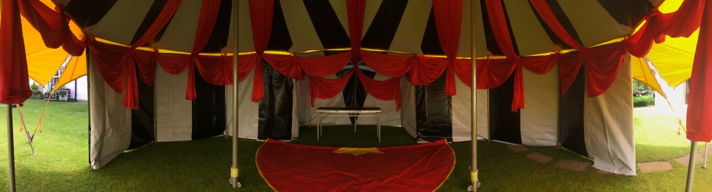 black and white big top with colourful red fabric