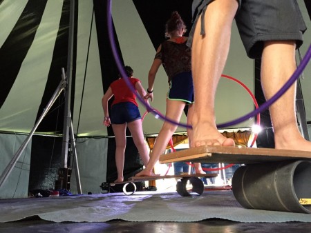 Three people train rola bola