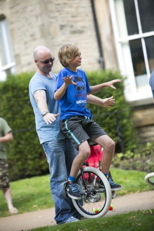 boy learns unicycle
